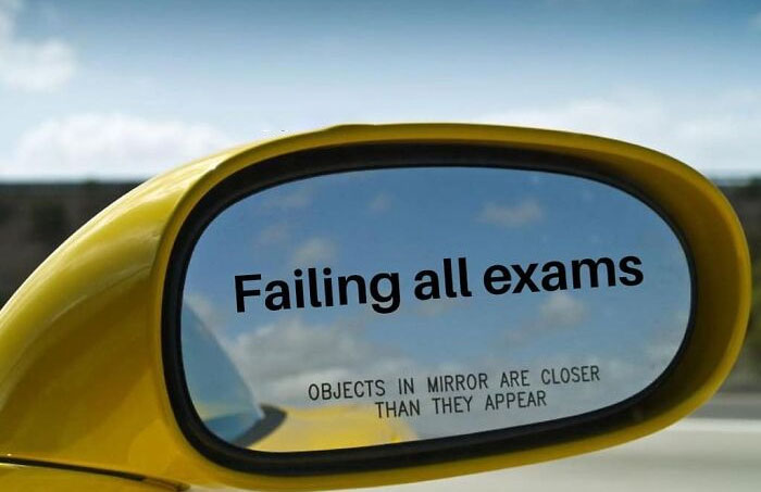 Car mirror reflecting "Failing all exams," a humorous take on mental health memes.