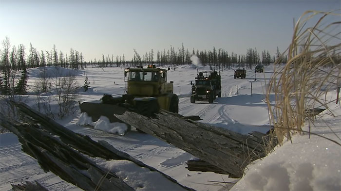 Picture of people driving on Siberian road to Yakutsk in Russia