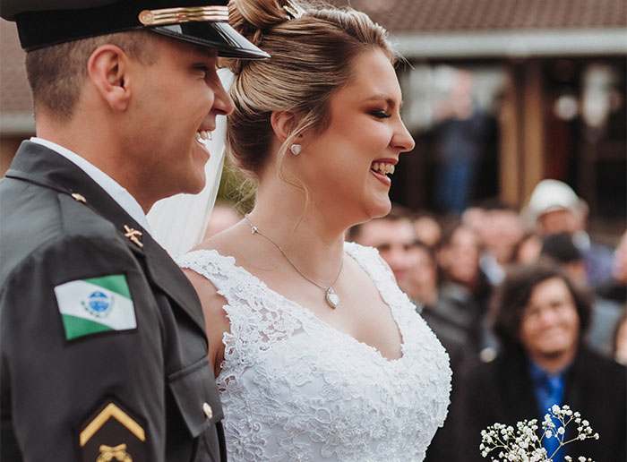 Bride and groom smiling during wedding ceremony, revealing deeply disturbing secrets about someone close to them.