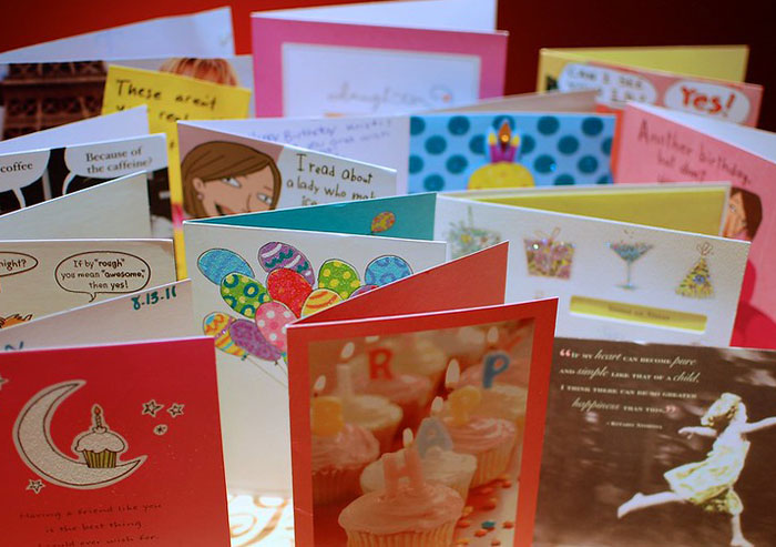 Various colorful greeting cards displayed together, revealing personal and deeply disturbing secrets discovered about someone close.