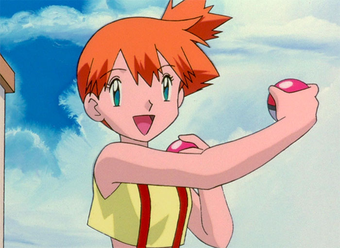 Misty Williams is happy and holds poke balls in both hands - 88