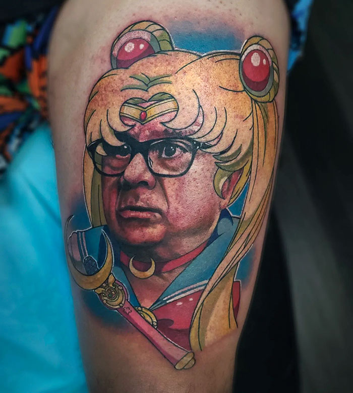 Unique tattoo combining a cartoon character with an unexpected face, showcasing unconventional tattoo choices.