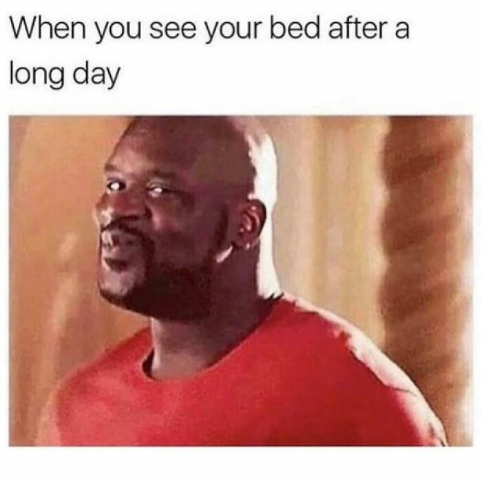 Relatable meme of a joyful man in a red shirt captioned 'When you see your bed after a long day.'