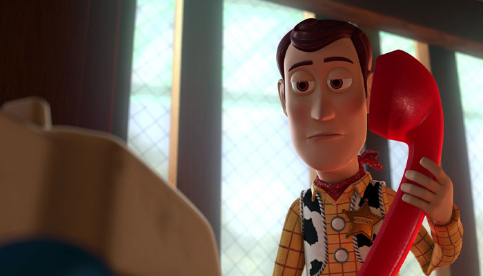 Woody looking disappointed while calling