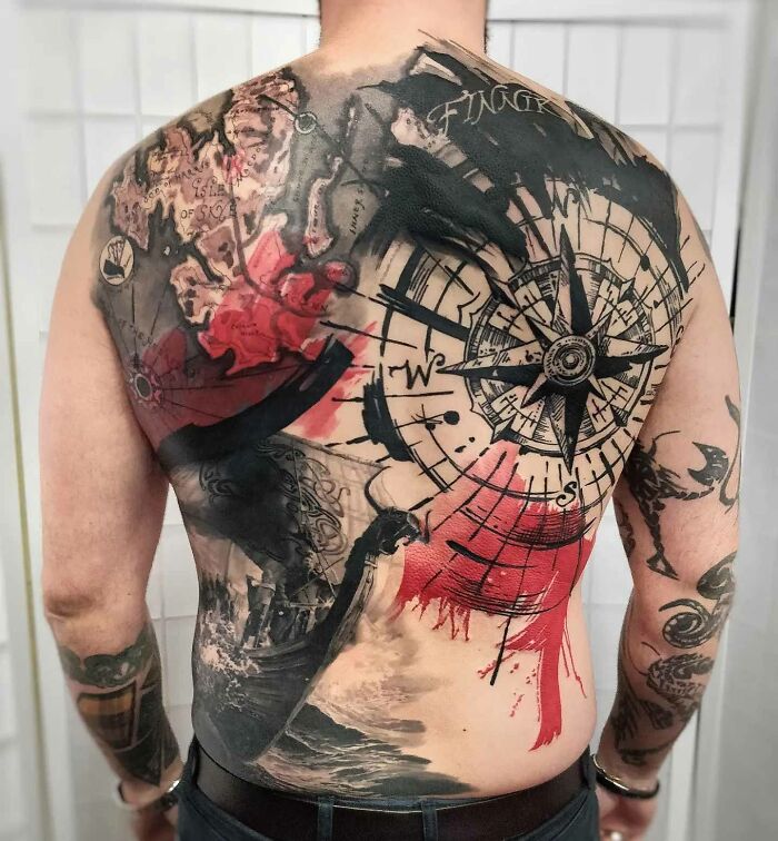 Back featuring an intricate Trash Polka tattoo design with a compass and splashes of red and black ink.