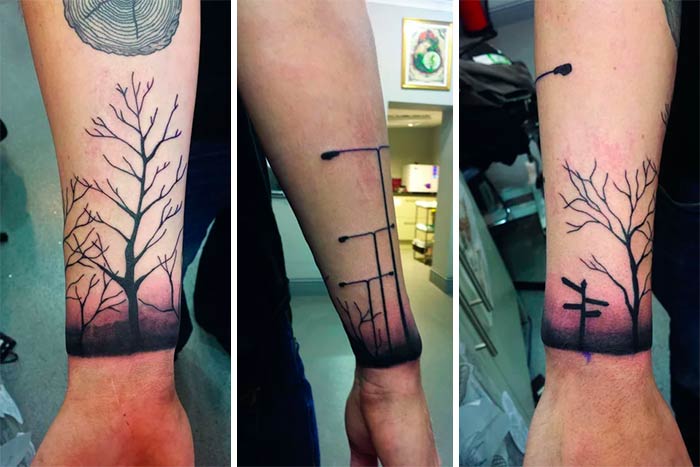 Majestic tree tattoos on forearms, featuring intricate branches and gradient shading.