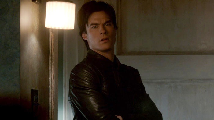 Damon with his arms crossed 