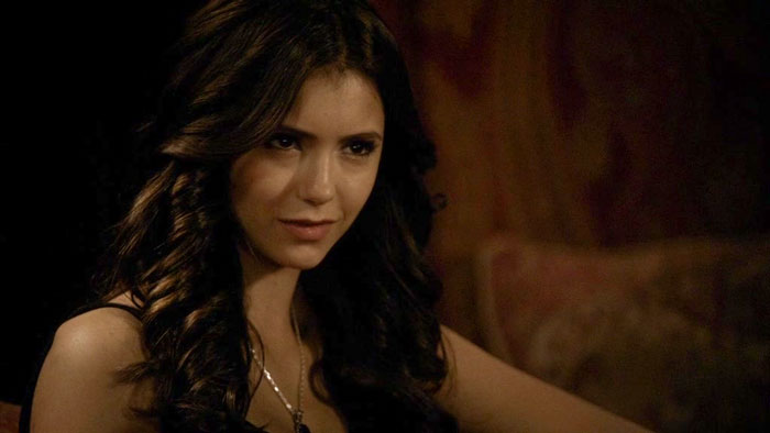 Katherine with curly hair smiling 