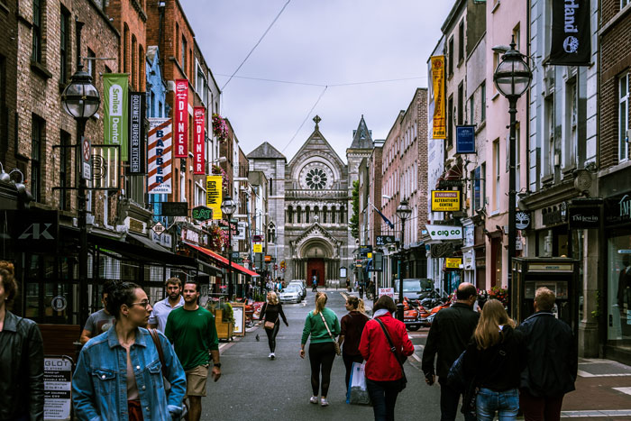 Busy city street with historic architecture and pedestrians, illustrating interesting and little-known facts about Vikings.