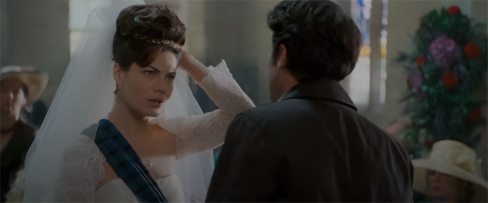 Bride adjusting her veil in a romantic scene from Made Of Honour, one of the best wedding movies ever made.
