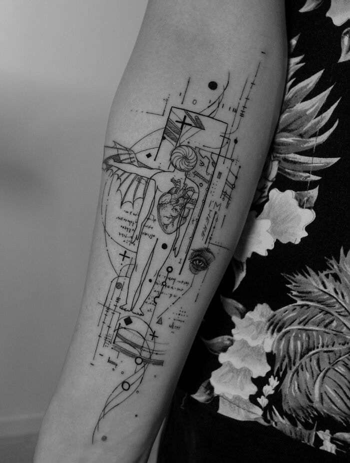 Geometric tattoo on forearm featuring intricate designs and shapes, showcasing a unique style by a talented tattoo artist.