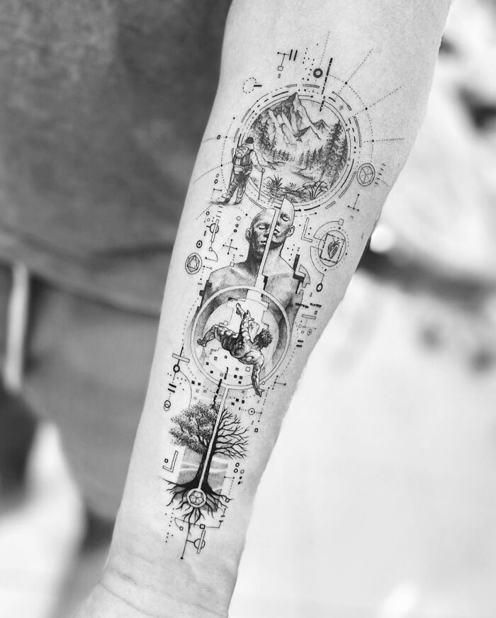 Geometric tattoo featuring nature and human figures intricately designed on a forearm.