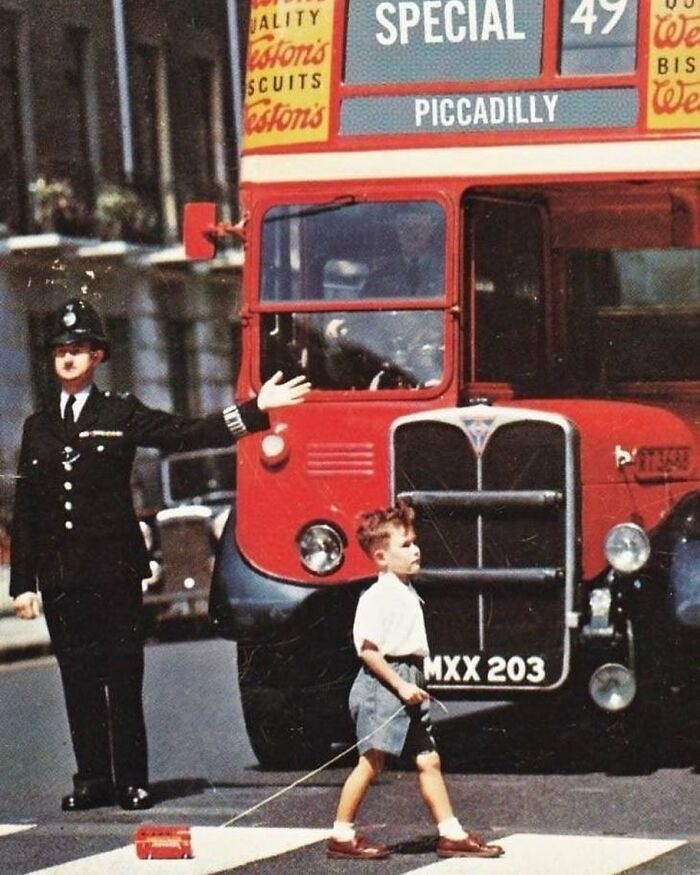 A Boy Crossing A London Street With A Toy Double Decker, 1960s