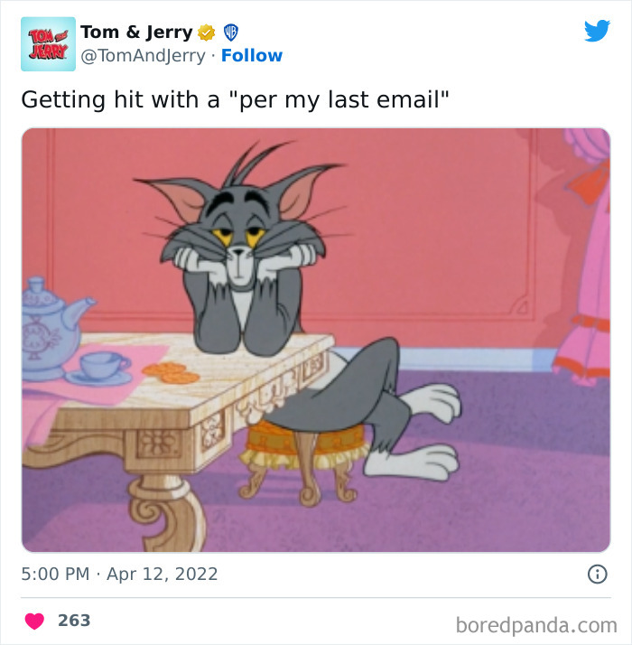 Tom sitting frustrated at a table, illustrating a relatable Tom & Jerry meme about work emails.