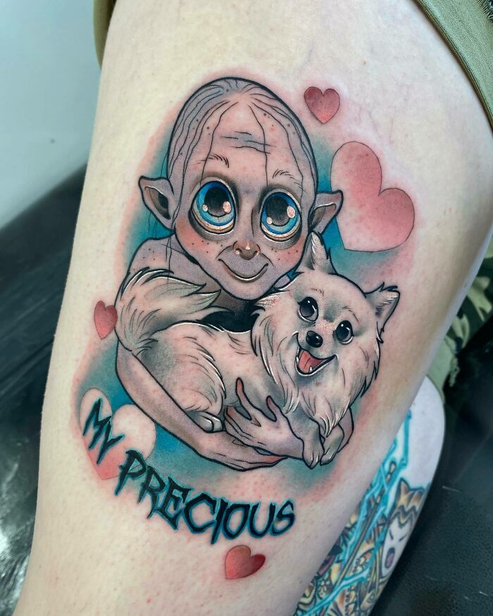 Gollum-inspired tattoo featuring a cartoon style, with "My Precious" text and pink hearts, ideal for Lord of the Rings fans.