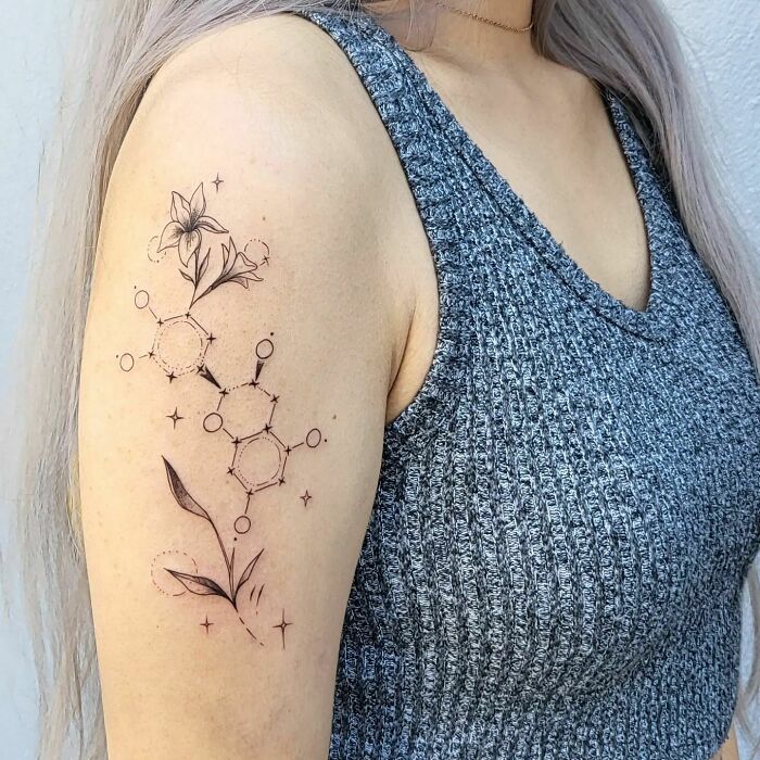 Science tattoo featuring a floral molecule design on arm, perfect for enthusiasts.