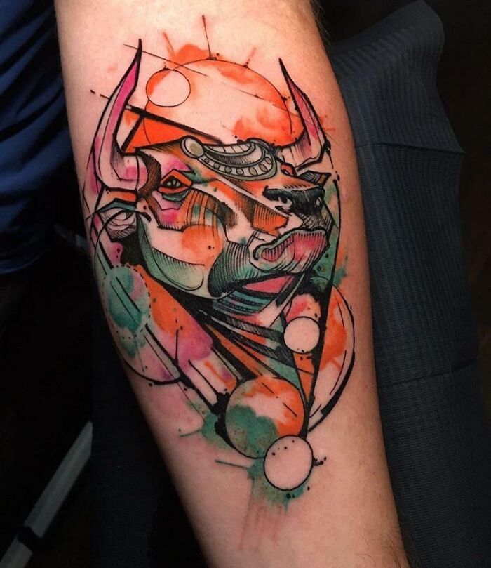 Colorful zodiac tattoo of Taurus with watercolor effects.