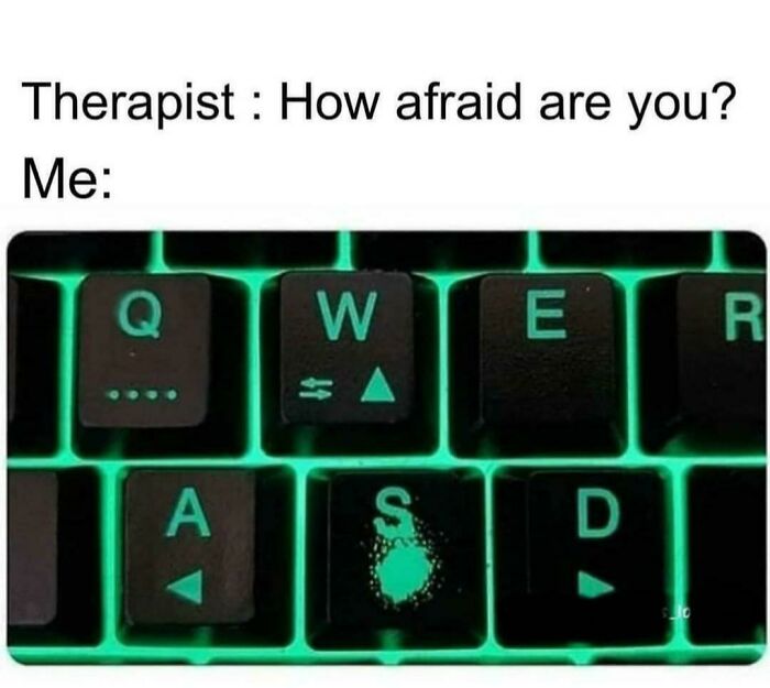 Meme of gaming keyboard with worn-out S key, highlighting gamer anxiety humor.