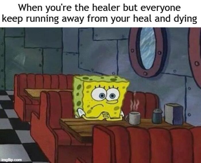 SpongeBob looking frustrated in a diner, capturing a relatable gaming meme moment about being a healer.