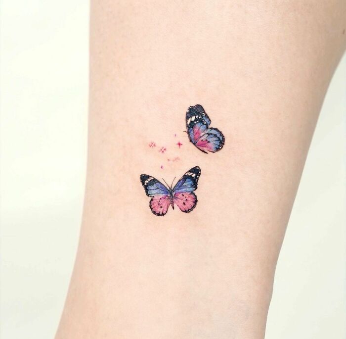 Colorful butterfly tattoo symbolizing mental health healing on the skin.