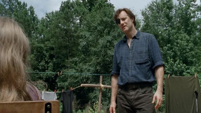 The Governor standing and watching 