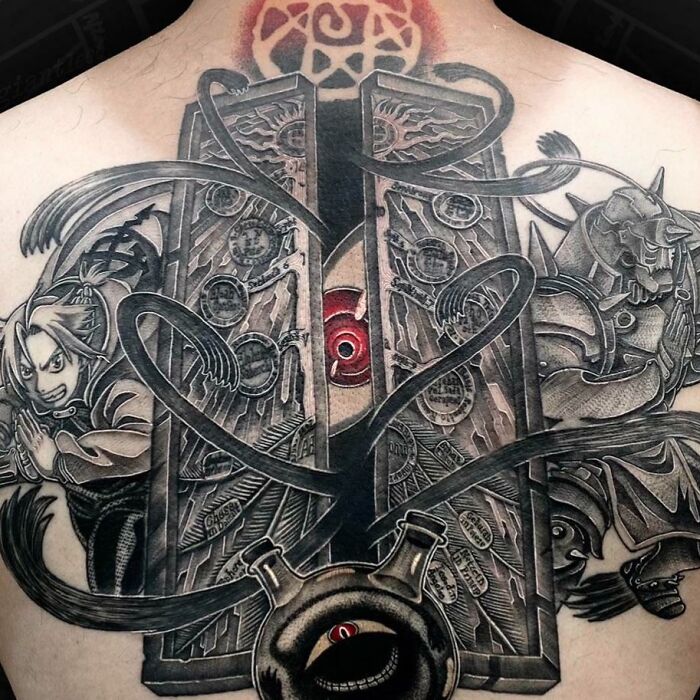 Intricate anime tattoo design on back, featuring detailed characters and elements in grayscale.
