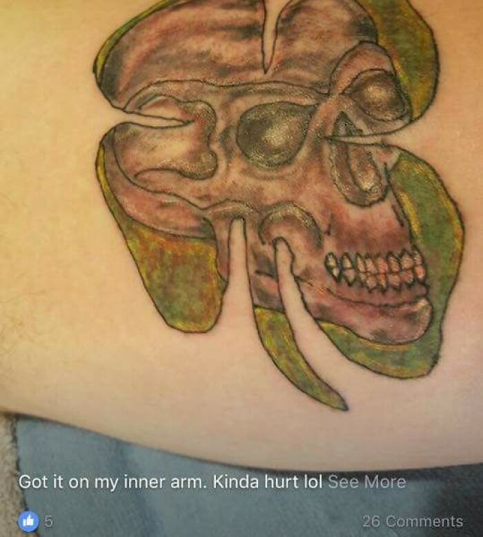 Unusual tattoo art with a skull and clover design, highlighting a tattoo fail on skin.