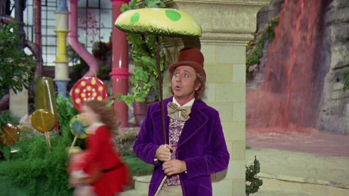 W***y Wonka standing under mushroom umbrella 