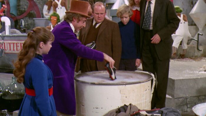 W***y Wonka throwing his shoe in the cauldron