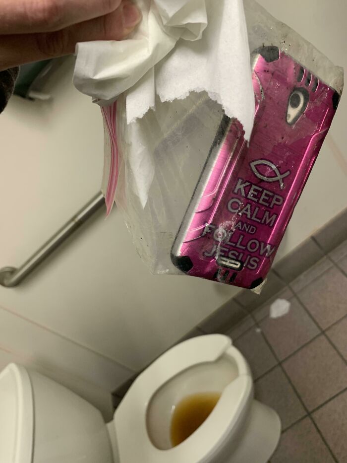 Toilet Water Turned Brown At Work No Matter How Many Times You Flushed It, Opened The Top Of The Toilet And Found Two Cellphones (You Can Only See One Here) Stashed In The Tank In A Ziplock Bag. Ft. The Gross-Looking Aforementioned Toilet Water In The Background