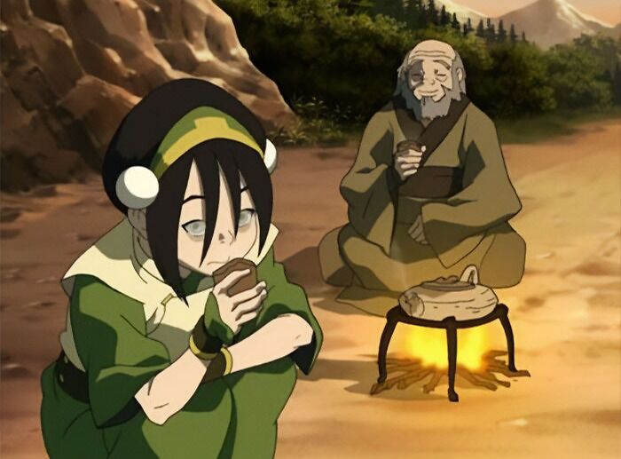 Uncle Iroh and Toph Bei Fong sitting by a campfire, sharing wisdom in Avatar The Last Airbender quotes.