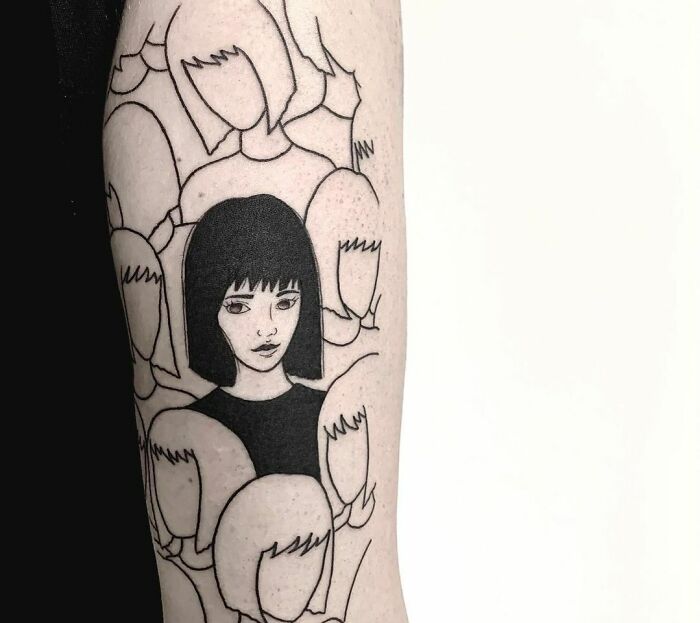 Mental health tattoo of a woman with a black bob haircut, surrounded by faceless figures, symbolizing individuality and mindfulness.