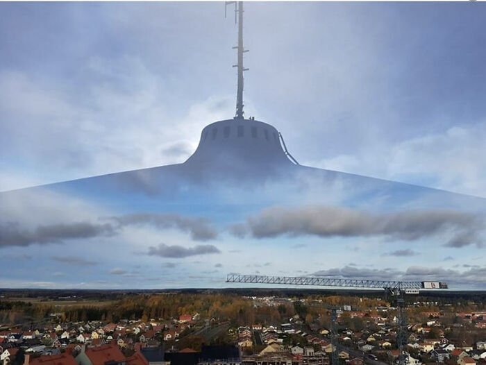 Reflection Of A Water Tower