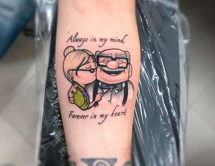 Tattoo of elderly couple with glasses and heartwarming text, symbolizing family honor and memory.