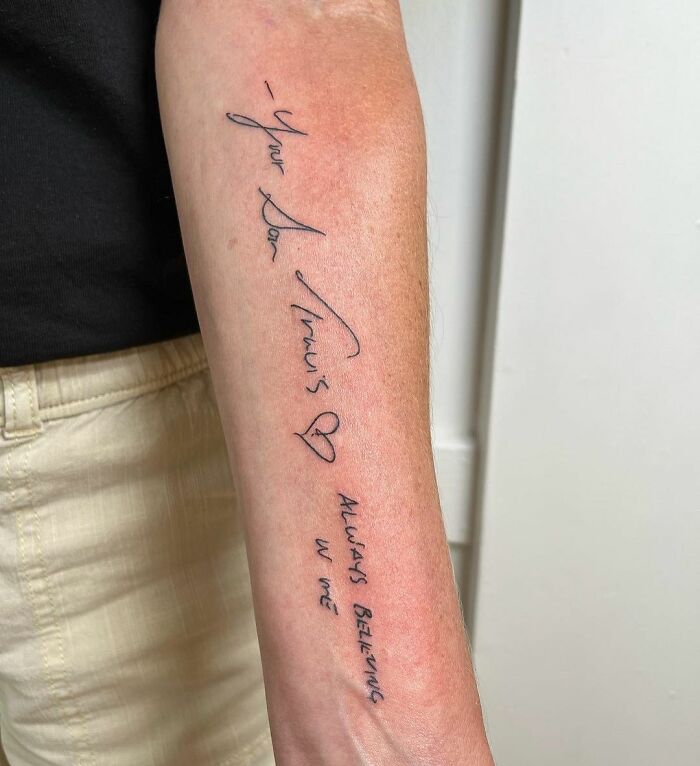 Family memorial tattoo on forearm featuring handwritten script in tribute.