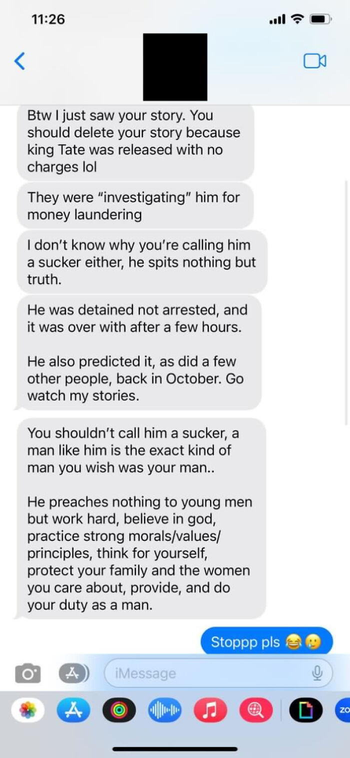 Embarrassing text exchange defending a controversial figure, with emojis included at the end.