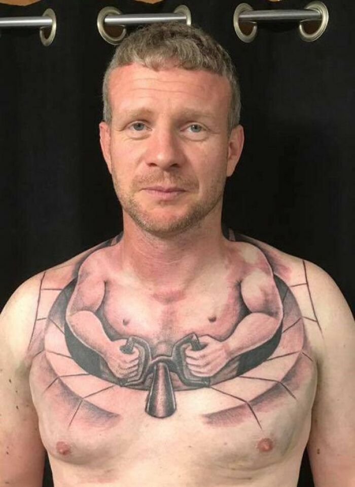 A man with a humorous tattoo of a torso holding a barbell on his chest.