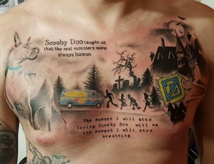 Scooby Doo-themed tattoo on a chest featuring characters, quotes, and scenes in a complex design.