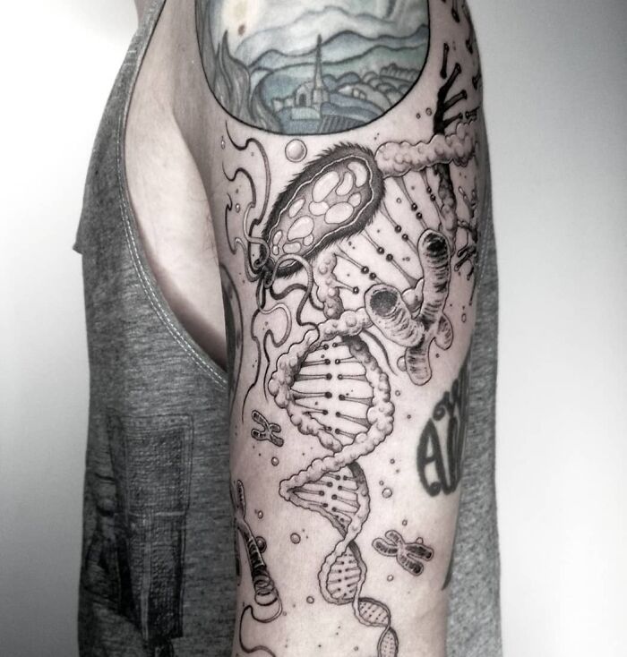 Arm tattoo featuring scientific designs including DNA and bacteria, perfect for science enthusiasts.