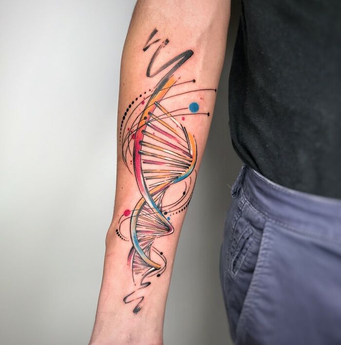 Colorful DNA science tattoo on forearm, showcasing intricate design and vibrant hues.