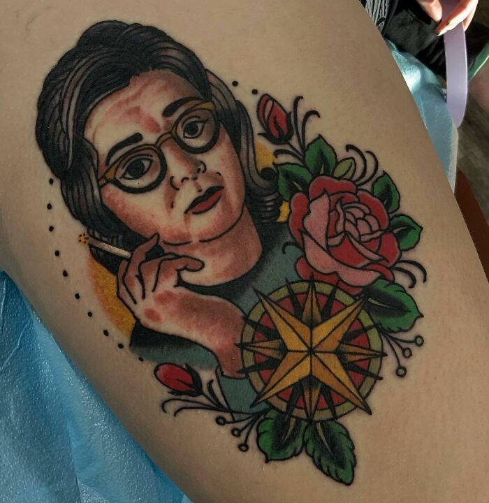 Science tattoo featuring a person with glasses, a rose, and a compass design.