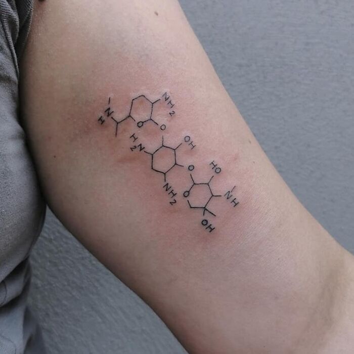 Chemical structure tattoo on arm, science-inspired ink.
