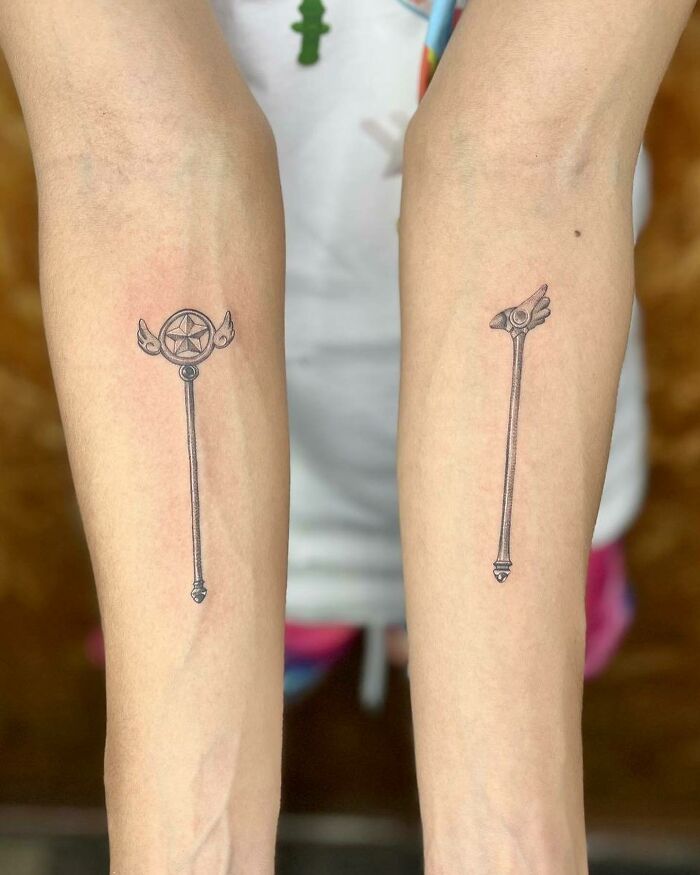 90s-inspired matching tattoos on forearms.