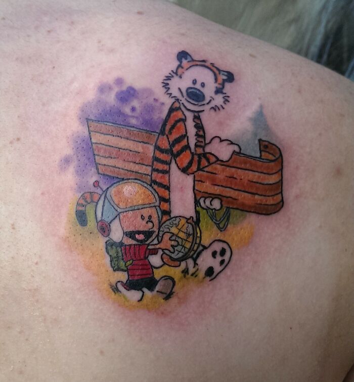 Retro '90s tattoo depicting a playful scene with classic cartoon characters.