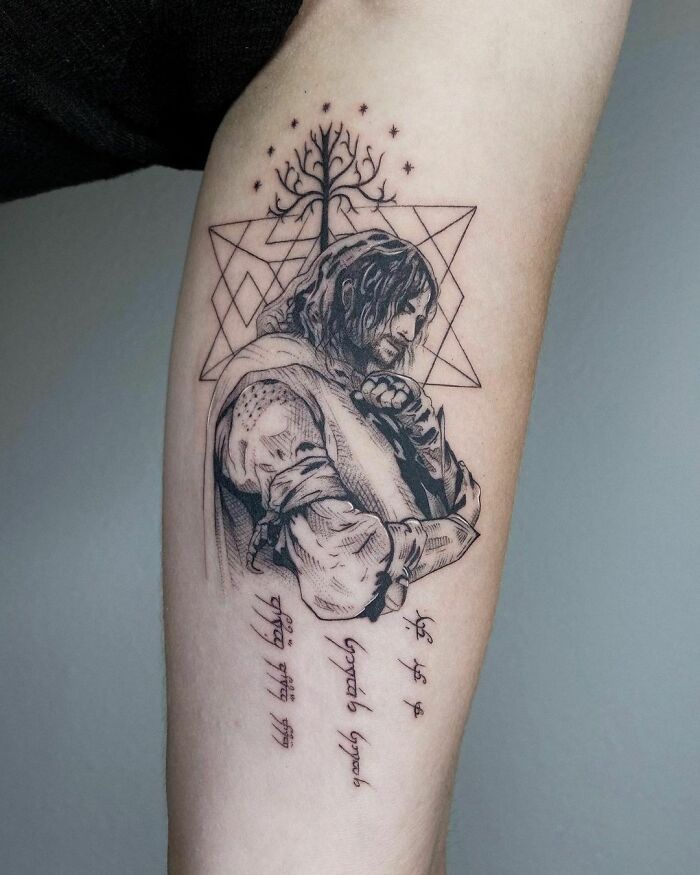 Detailed Lord of the Rings tattoo featuring a character with elvish script and the White Tree of Gondor.