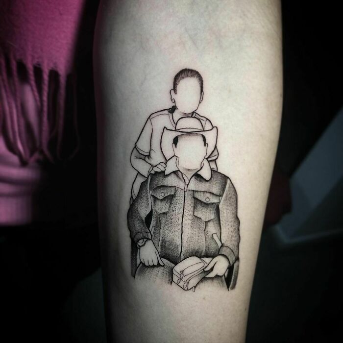Tattoo depicting two faceless figures, symbolizing family, inked in monochrome on forearm.