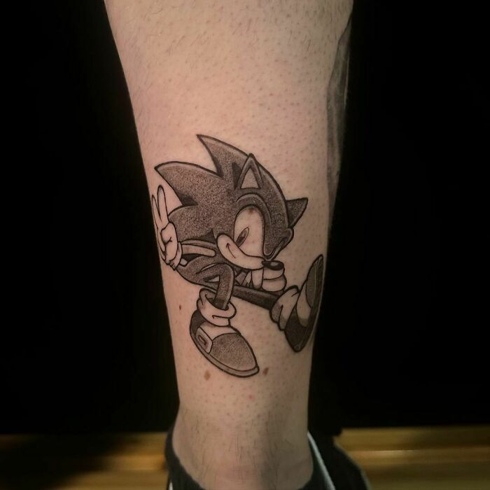 Video game tattoo featuring Sonic The Hedgehog character on a person's leg, popular among hardcore gamers.