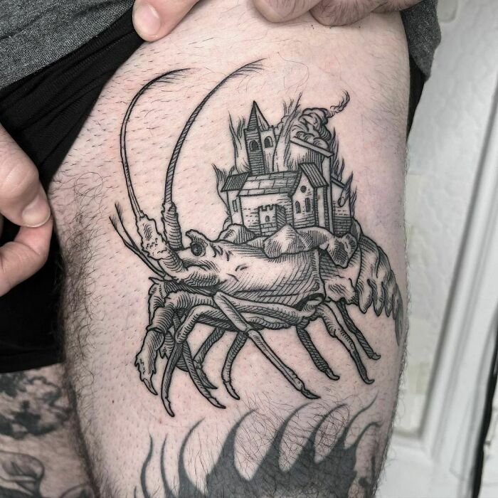 Gothic tattoo of a detailed crab with a castle on its shell, inked on a person's thigh.