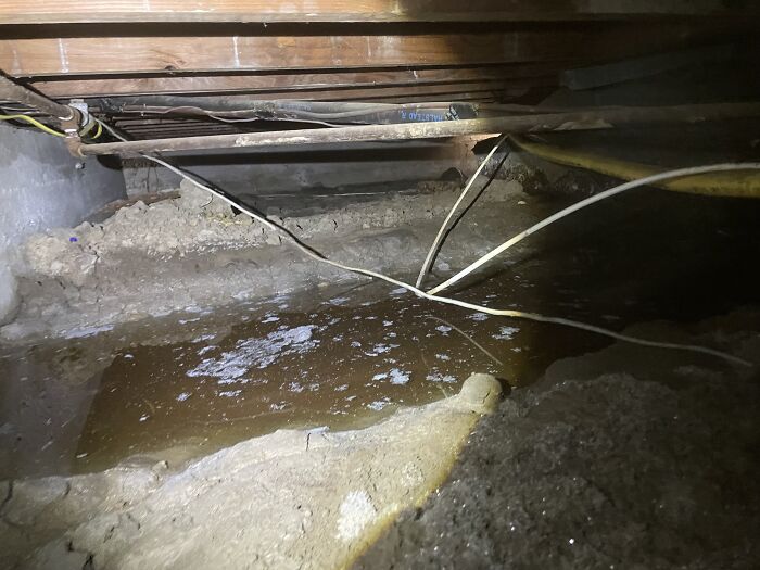 A Significant Amount Of Water Had Found Its Way Into This Crawlspace, Leading To Potential Issues. Factors Like Overflowing Gutters And Excessive Groundwater Can Contribute To Damp Crawlspaces. Thankfully, We Spotted This Puddle Before Going Any Further