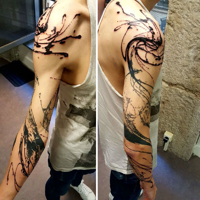 Arm with an abstract tattoo design showcasing artistry and self-expression.